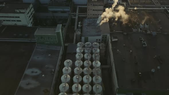 Aerial View of a Drone Flying Over the Beer Production Plant Several Rows of Tanks