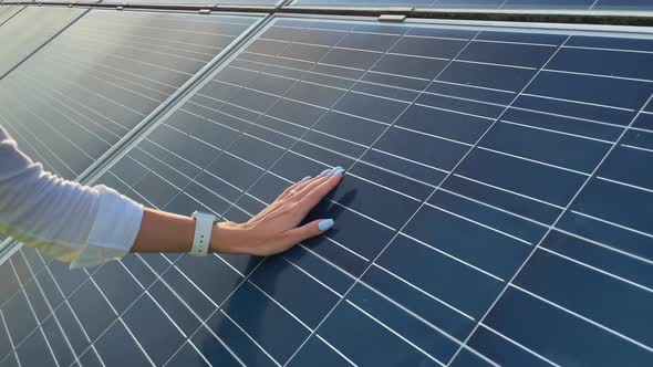 Close Up of a Young Woman Engineer Hand is Checking the Operation of Sun and Cleanliness of