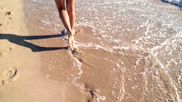 Young Woman Legs Walking on White Sand with Waves at Beach in Island, Cinematic