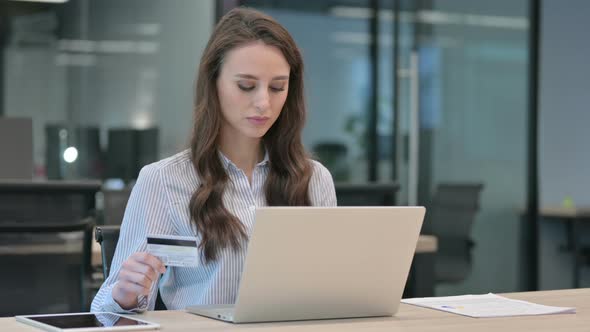 Successful Online Shopping on Laptop by Young Businesswoman