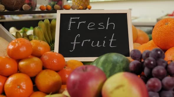 Closeup of Various Fruits in a Grocery Store with a Sign for FRESH FRUIT