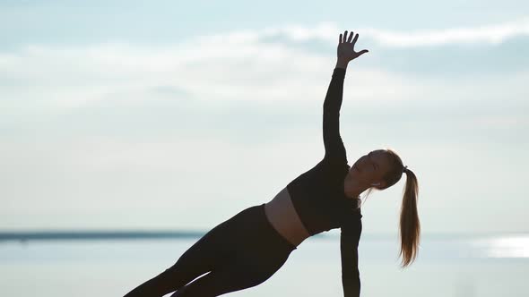 Sports Female Raising Hands Enjoying Outdoor Physical Activity on Beach