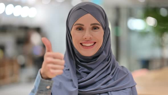 Positive Arab Woman with Thumbs Up Sign 