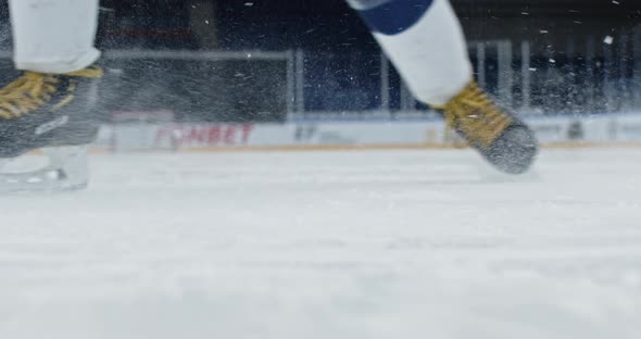 Man Hit Puck Close Up Stick on Rink Hockey Slow Motion Splash Snow Goal Player.