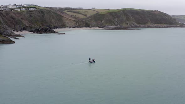 Fishing Boat on a Grey Day Out Catching Fish Aerial View