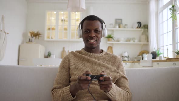 African American Man Wins Playing Video Game Console