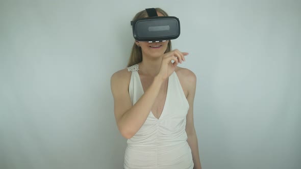 Young Girl Uses Virtual Reality Helmet Applications