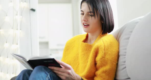 Woman Reading Book at Home Weekend