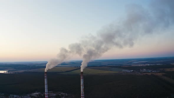 White smoke goes from pipes into the air