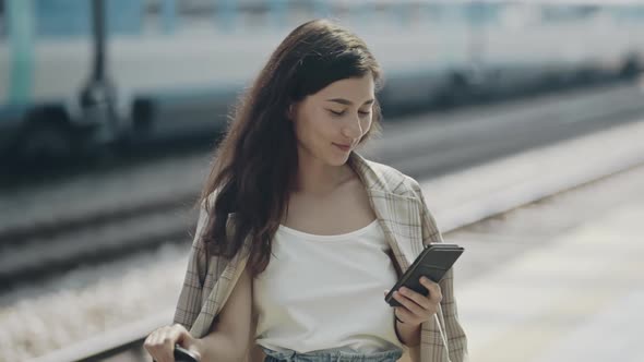 Close Look Portrait of Beautiful Businesslady Waiting for a Train on Railroad Station