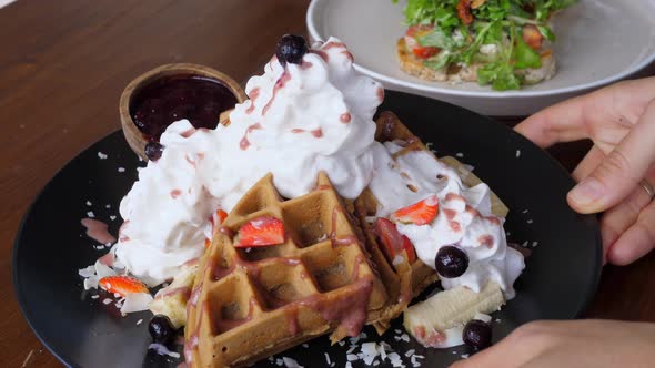 Belgian Waffles with Cream and Berries on Breakfast