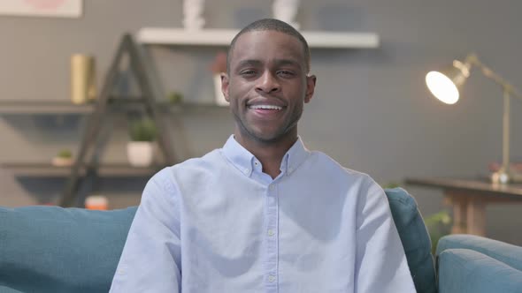 Portrait of African Man Smiling at the Camera Sofa