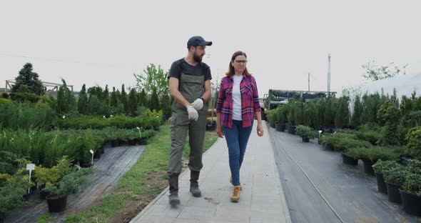 Gardeners Walking in Nursery Garden