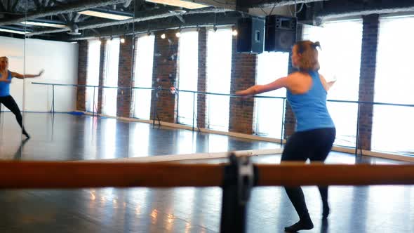 Ballerina practicing in front of mirror