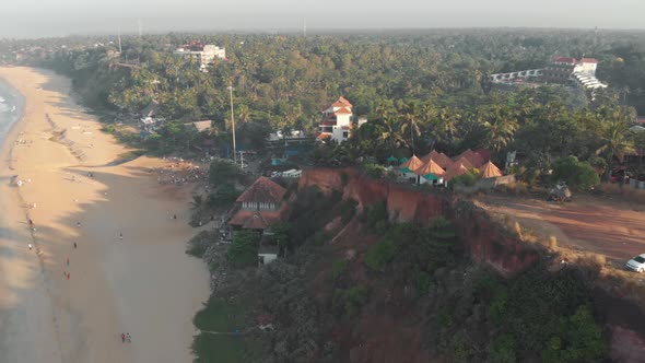 Varkala Cliff with a sight of the sea and the lush vegetation near the shoreline, in India