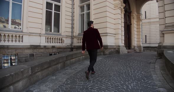 Guy Travels Looking At The Medieval Architecture Of The Castle