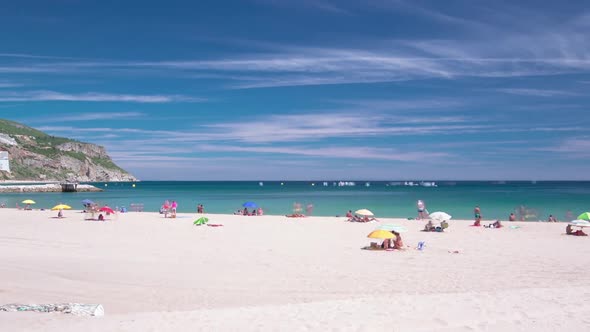 Beach in Sesimbra with Moving Clouds Portugal Timelapse