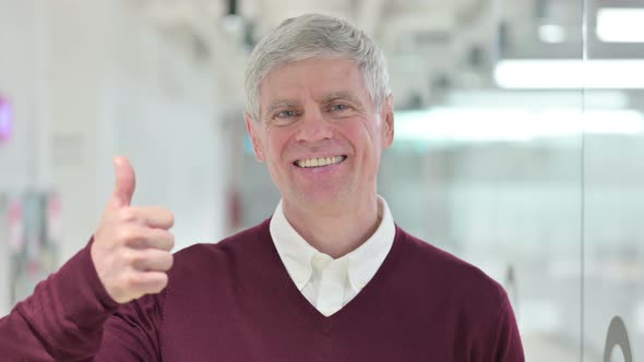 Successful Middle Aged Man Showing Thumbs Up