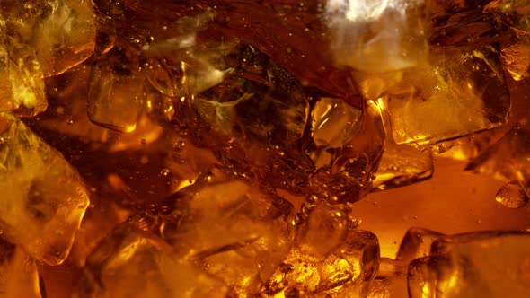 Super Slow Motion Shot of Whirling Fresh Cola and Ice Cubes at 1000Fps