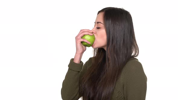 Portrait of Woman on Diet Wearing Casual Eating Green Juicy Apple Tasting Enjoying Fruit During