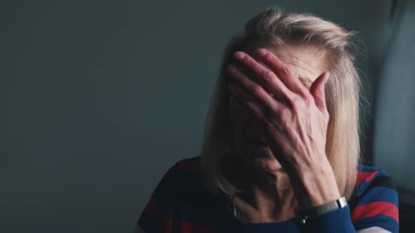 Desperate Elderly Woman Reading Eviction Notice