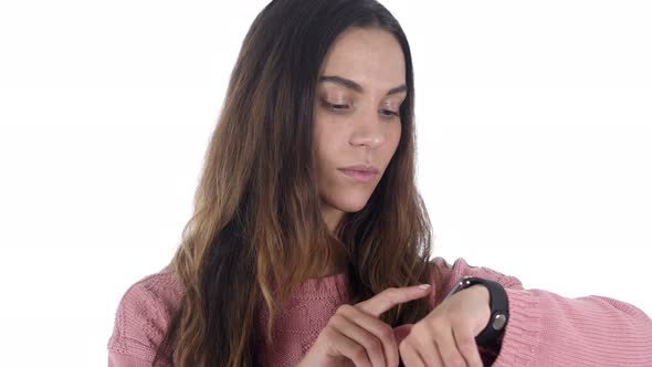 Beautiful Latin Woman Using Smartwatch, Browsing Online