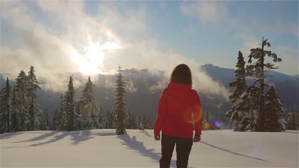 Adventure Woman Hiking on Top of Canadian Mountains