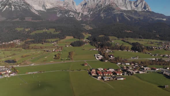 AERIAL: Tilt up drone shot of famous mountain panorama in austrian alps