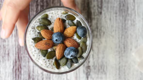 Healthy Chia Seed Pudding In A Glass With Fresh Berries And Nuts