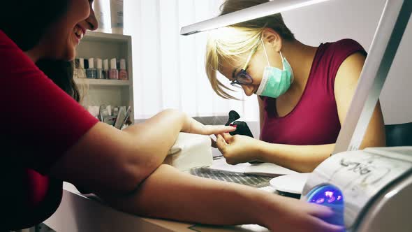 Woman at Manicure Treatment