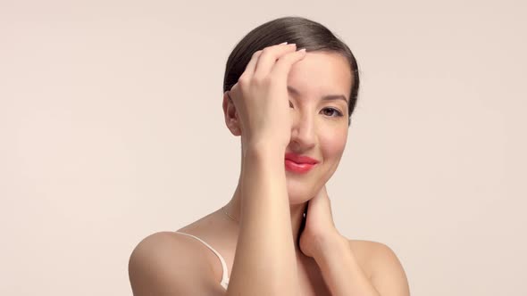 Beauty Brunette Model in Studio Alone with Ideal Shiny Skin Portrait