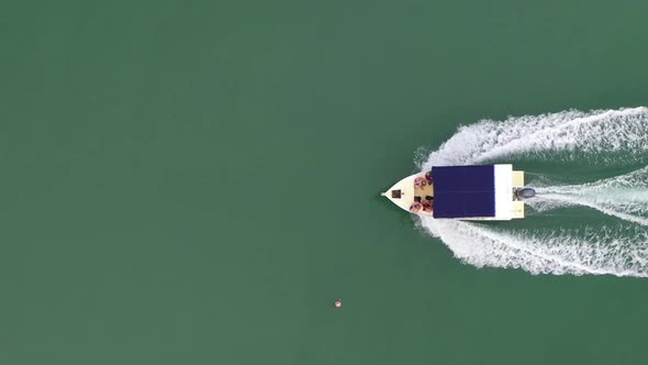 aerial follow shot of a small motor boat in the Indian Ocean off Madagascar