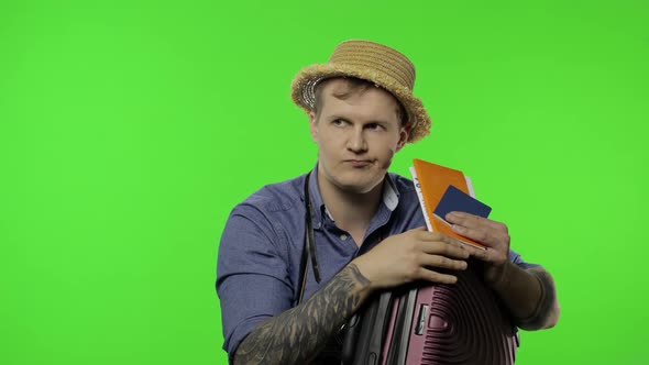 Portrait of Man Tourist with Suitcase, Passport and Tickets. Chroma Key