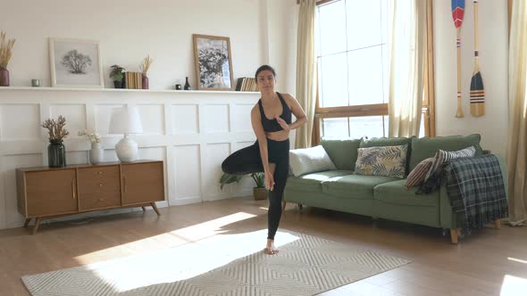 A young Indian Woman Meditates in the Morning a Bright Room At Home