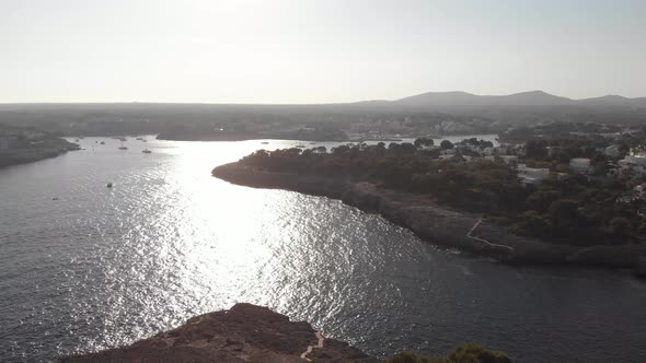 AERIAL: view of the beautiful coastline of Mallorca Island during sunset