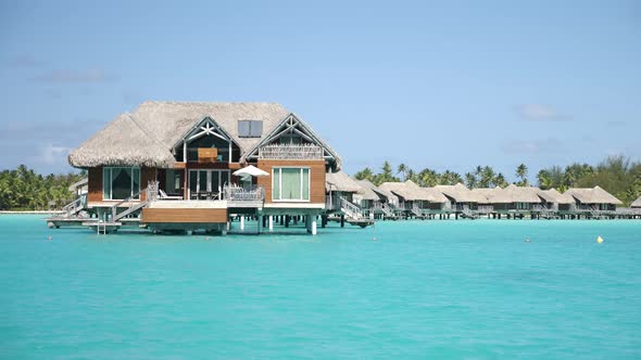 Cruising on a Yacht Around Bora Bora with a View of Water Villas