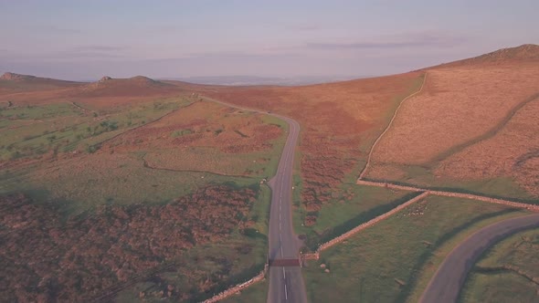 Car driving through Dartmoor National Park, Devon, England, UK, Aerial drone view