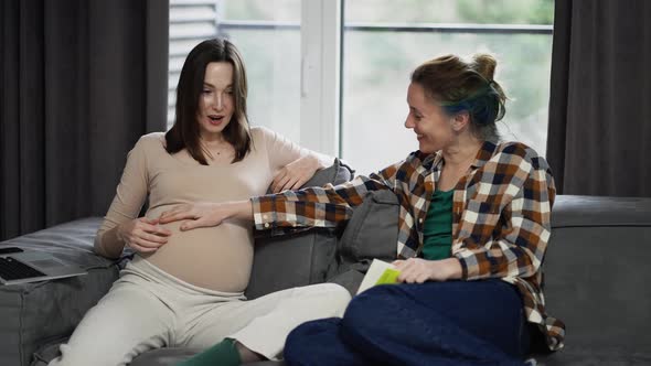 Woman Touching Pregnant Belly Feeling Baby Movement Friendship Closeness