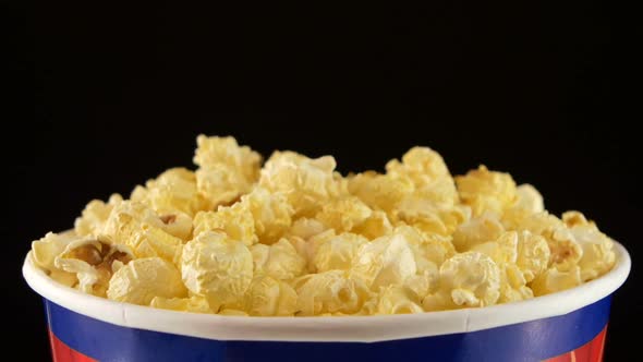 Popcorn in Box on Black, Close Up, Rotation