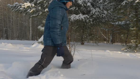 Caucasian White Boy Walk By Snow Drift Winter Park Outdoors