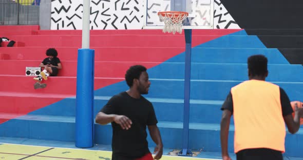 African friends playing basketball outdoor - Urban lifestyle concept