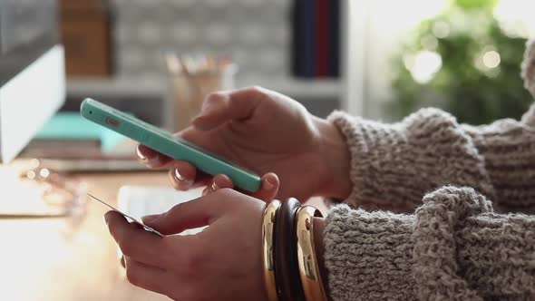 Young Woman Buys Online Using her Phone