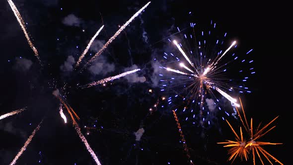 Fireworks Flashing in the Night Sky. Slow Motion. Real Fireworks with Smoke