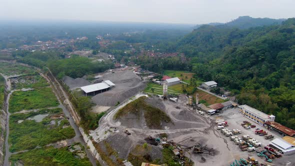 Machines in concrete factory in topical forest, Muntilan, Indonesia, aerial view