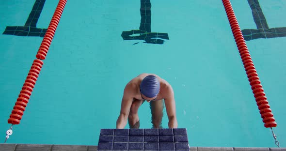 Swimmer diving into the pool