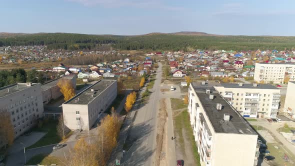 Aerial view of A provincial Russian city with low buildings. Autumn sunny day 39