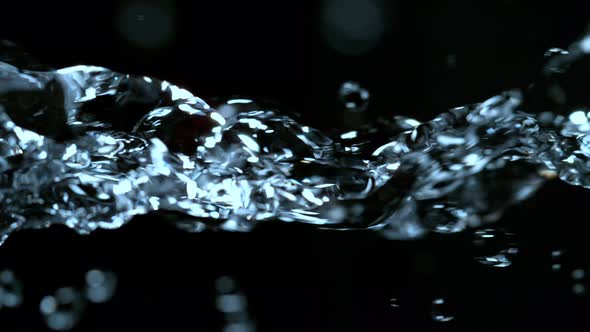 Super Slow Motion Shot of Flowing Water at 1000Fps Isolated on Black Background