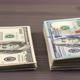 pack of one hundred american dollars moving from right to left - VideoHive Item for Sale