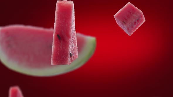 Flying of Watermelon and Slices in Deep Red Background