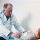 Doctor finishing stomach inspection - VideoHive Item for Sale
